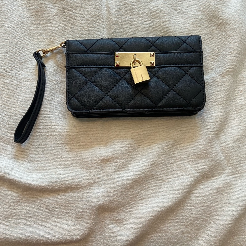 Wristlet black gold accents & stylish lock on then front